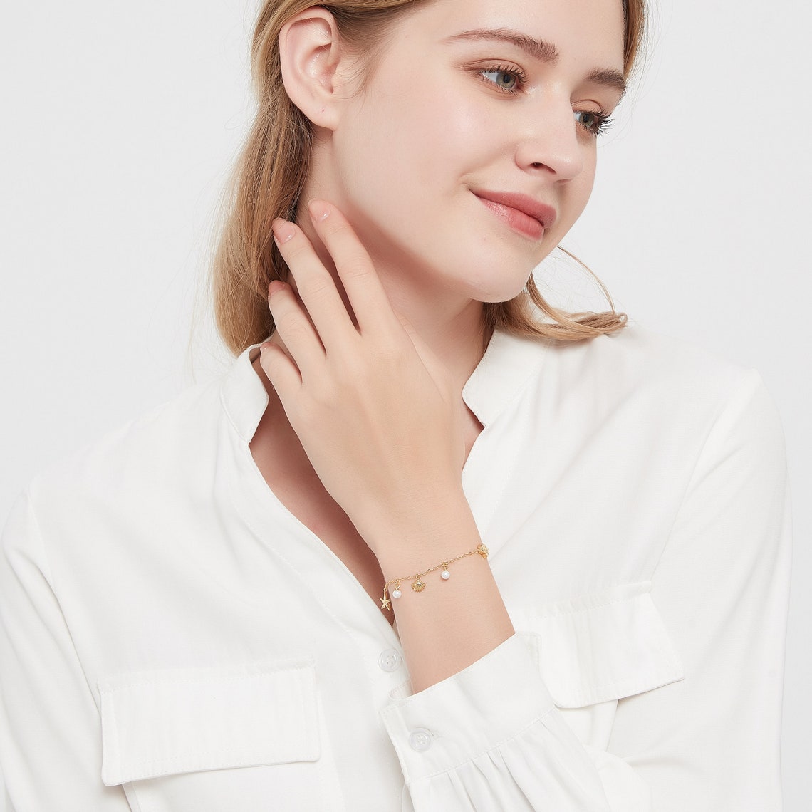 Armband mit Muschel und Seestern