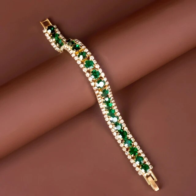 Maud – Elegante goldene Armband mit grünen Akzenten