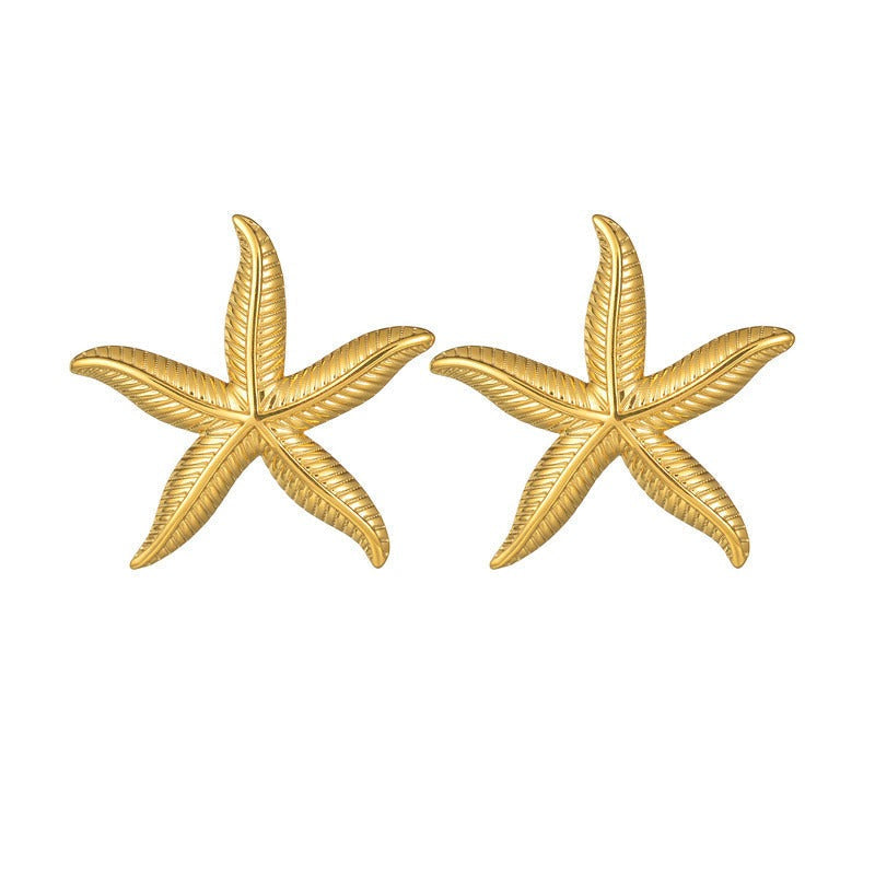 Pien – Ohrringe in Form von goldenen Seesternen